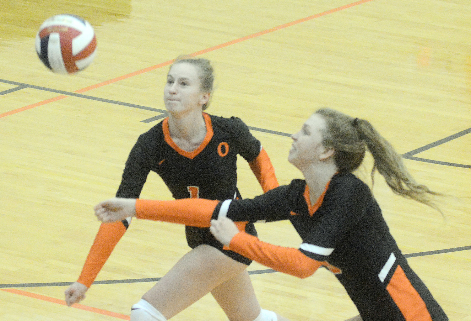 Molly Wnuk and Anna Heidbrink (above, from left) give chase to a volleyball during Owensville’s home Four Rivers Conference (FRC) volleyball match last Thursday against Union’s Lady Wildcats. Falling in five sets to UHS, Owensville will compete in tournament action at Hermann and Rolla during the coming week.